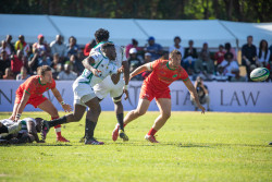 Zimbabwe scrumhalf, Hilton Mudariki makes a quick pass off a ruck.-1853.jpg