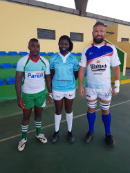 Captains of Namibia and Madagascar with the referee Precious Pazani.jpeg