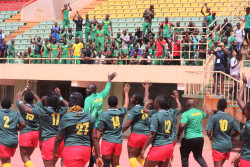 Cameroonian team celebrating their victory in front of supporters from Burkina Faso.JPG