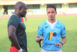 Societe Generale and a Cameroonian Rugby Player In Discussion Mid Game .JPG